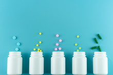 Medicines, Supplements And Drugs In A Bottle On Blue Background