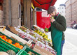 © Lumi Images - Greengrocer's shop, grocer smelling fruit