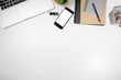 © Kanchana - office desk table top header layout on top smartphone isolated notebook grey black brown laptop computer gadget