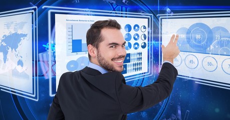 Wall Mural - Businessman touching and interacting with technology interface