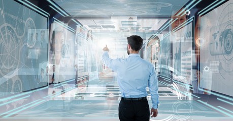 Wall Mural - Businessman touching and interacting with technology interface