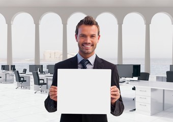 Poster - Happy business man holding blank card in office