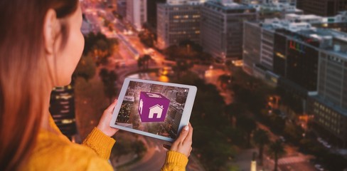 Poster - Composite image of smiling asian woman using tablet