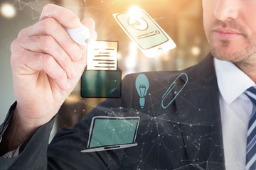 Poster - Composite image of serious businessman writing with marker