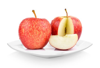 apples in white plate on white background