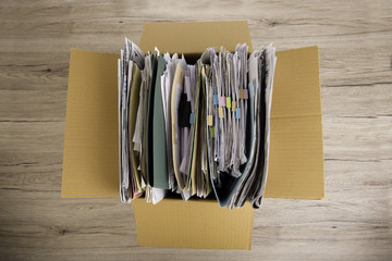 Documents File in the Brown box in office