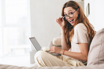 Wall Mural - Happy amazing pretty lady using tablet computer.