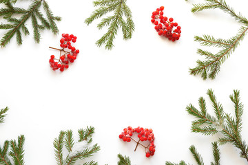 Wall Mural - Christmas background. Fir branches isolated on white background. Christmas tree. Christmas toys, snow, fir, rowan in frost, top view. Composition of fir branches, pattern. Christmas frame.