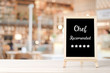 © mangpor2004 - Chef recommend and five star on blackboard standing over blur restaurant background, copy space for text, food and drinks background, banner