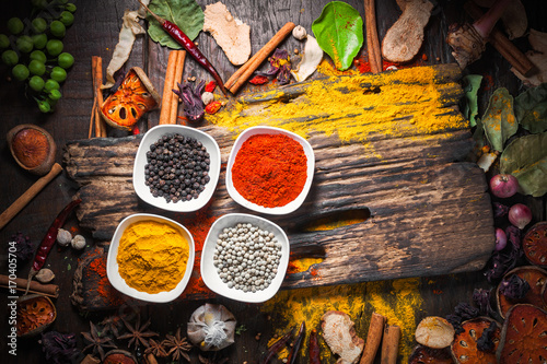 Stampe Selection of spices herbs and ingredients for cooking, Food background on wooden table, Top view, Thai cuisine