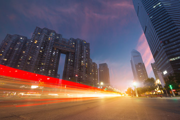 Wall Mural - The light trails on the modern building background in shanghai china.