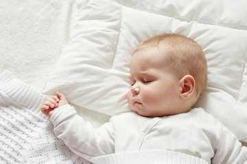 Wall Mural - Baby sleeping covered with soft blanket