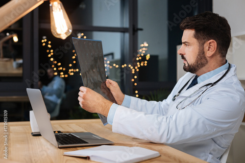 Fotografie, Obraz Smart experienced doctor putting a diagnosis
