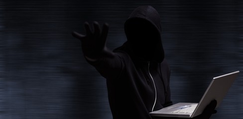 Poster - Composite image of hacker holding laptop while gesturing