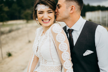 Wedding couple near the red stable