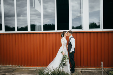 Wedding couple near the red stable