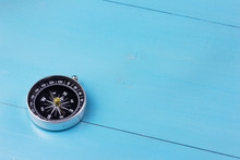 Compass On Wooden Background