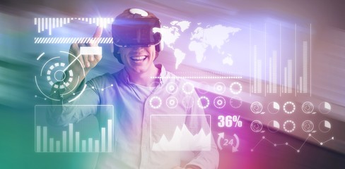 Poster - Composite image of smiling man using black virtual reality
