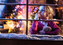 On Christmas Night A Lovely Little Girl Looking Out The Window