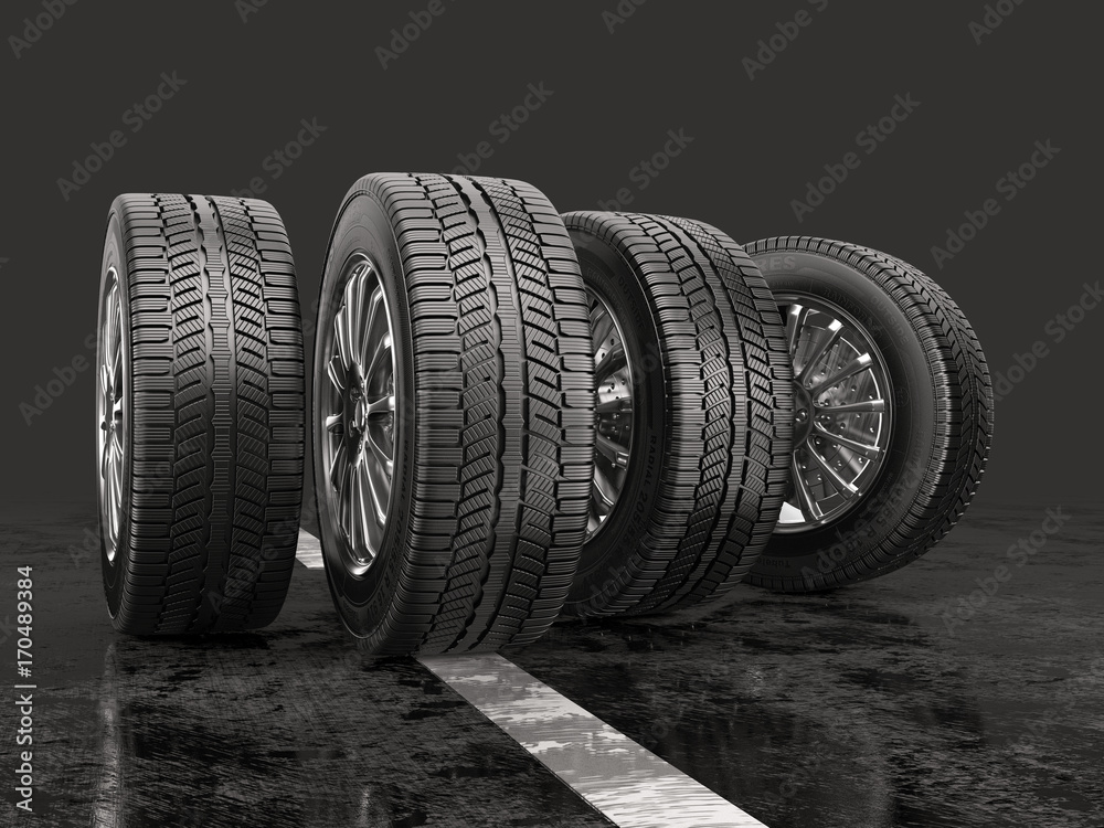 Four car tires rolling on a road on a gray background. - obrazy, fototapety, plakaty 