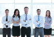 © ASDF - Group portrait of a professional business team looking confident