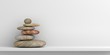 Zen stones on a white shelf. 3d illustration