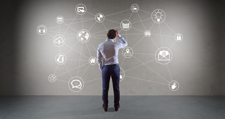 Poster - Businessman using social network interface on a wall 3D rendering