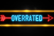 Overrated  - fluorescent Neon Sign on brickwall Front view