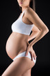 © LIGHTFIELD STUDIOS - belly of pregnant woman