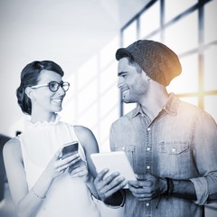 Poster - Composite image of smiling woman and man holding a phone and