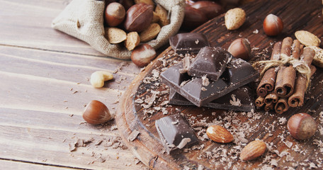 Wall Mural - pieces of chocolate with nuts and cinnamon