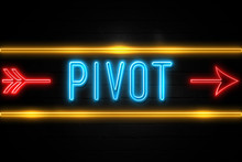 Pivot  - Fluorescent Neon Sign On Brickwall Front View