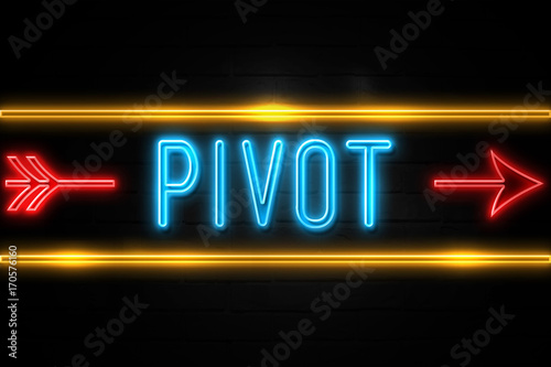 Fotografía Pivot - fluorescent Neon Sign on brickwall Front view