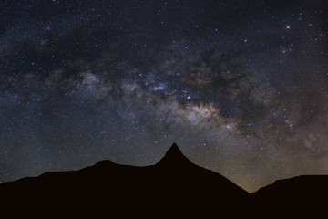 Wall Mural - starry night sky with high moutain and milky way galaxy with stars and space dust in the universe