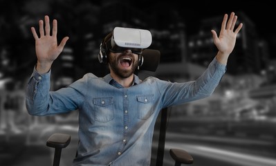 Wall Mural - Composite image of cheerful man using virtual reality glasses