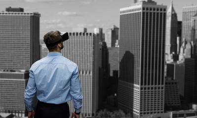 Poster - Composite image of man holding virtual reality glasses