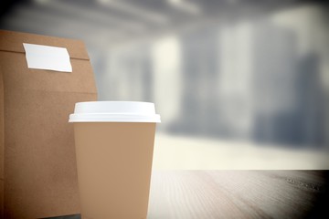 Poster - Composite image of disposable coffee cup and parcel bag 