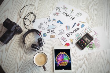 Poster - Composite image of colorful wheel of fortune on mobile display