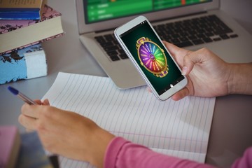 Poster - Composite image of wheel of fortune on mobile display