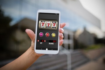 Aufkleber - Composite image of casino slot machine app on mobile display