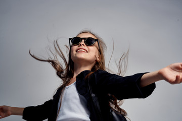 girl in sunglasses, hair in the wind, happiness, smile