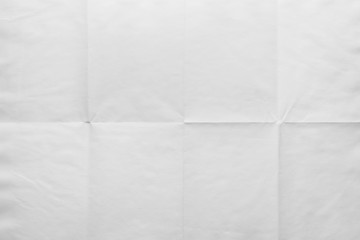 Empty sheet of paper folded in eight, texture background
