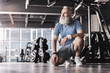 © Yakobchuk Olena - Joyful old male is spending time in modern gym