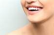 © Africa Studio - Young woman with healthy teeth laughing on light background, closeup