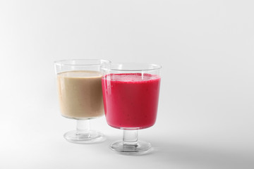 Poster - Glasses with different smoothies on white background