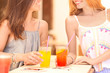 © Africa Studio - Beautiful young women drinking lemonade in cafe