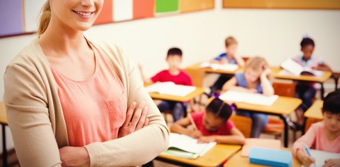 Canvas Print - Portrait of pretty teacher smiling while standing at classroom