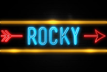 Rocky  - Fluorescent Neon Sign On Brickwall Front View