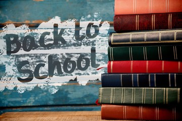 Poster - Composite image of back to school text on pink splash