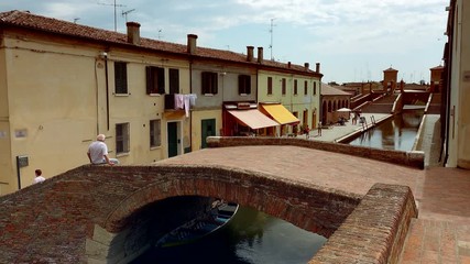 Canvas Print - Venetian feelings of tourists on XVII bridges of an old lagoon town near Ferrara in color graded clip